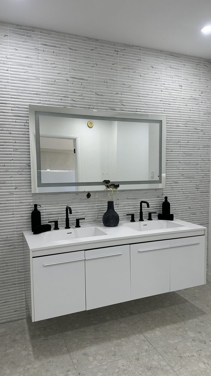 Master bathroom remodel detail with black fixtures by DYS Construction